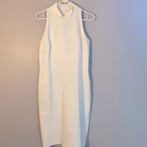 Size 8 creamy white dress hangs just below the knees. White House Black Market